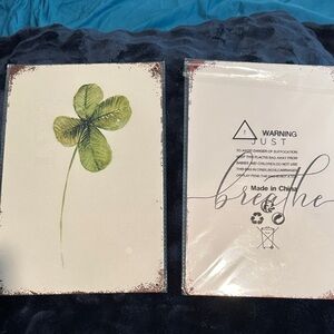 Green Four Leaf clover and Just Breathe Metal signs